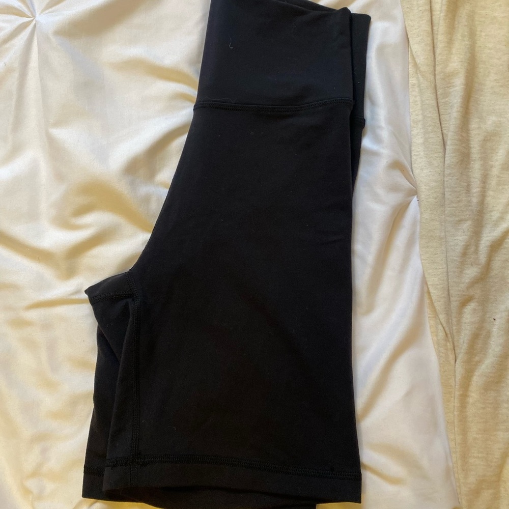 ARITZIA TNA super high rise black biker shorts.